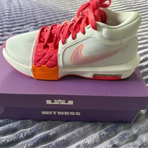 Nike Men’s White and Pink Sneakers with Orange Accents
LeBron Witness VIII